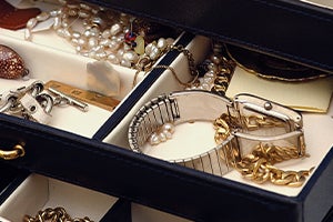 jewelry box with jewelry and watch